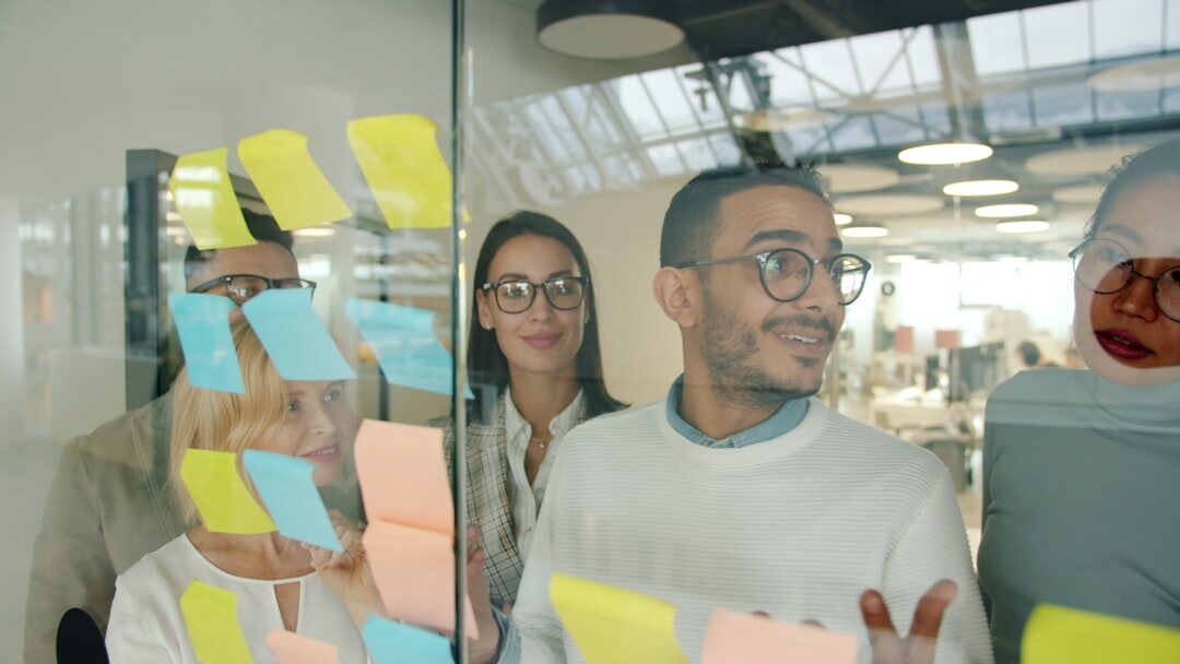 Team of professionals reviewing digital innovation strategy on a screen