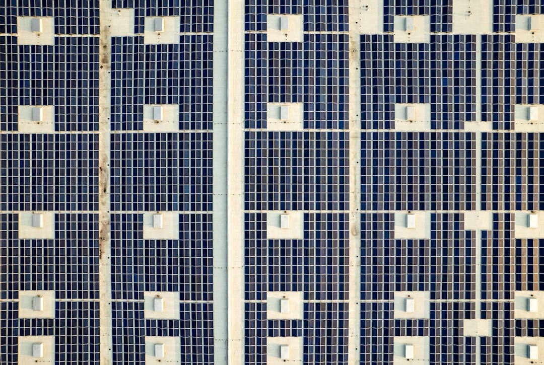 Engineers inspecting solar panels for a sustainable business project
