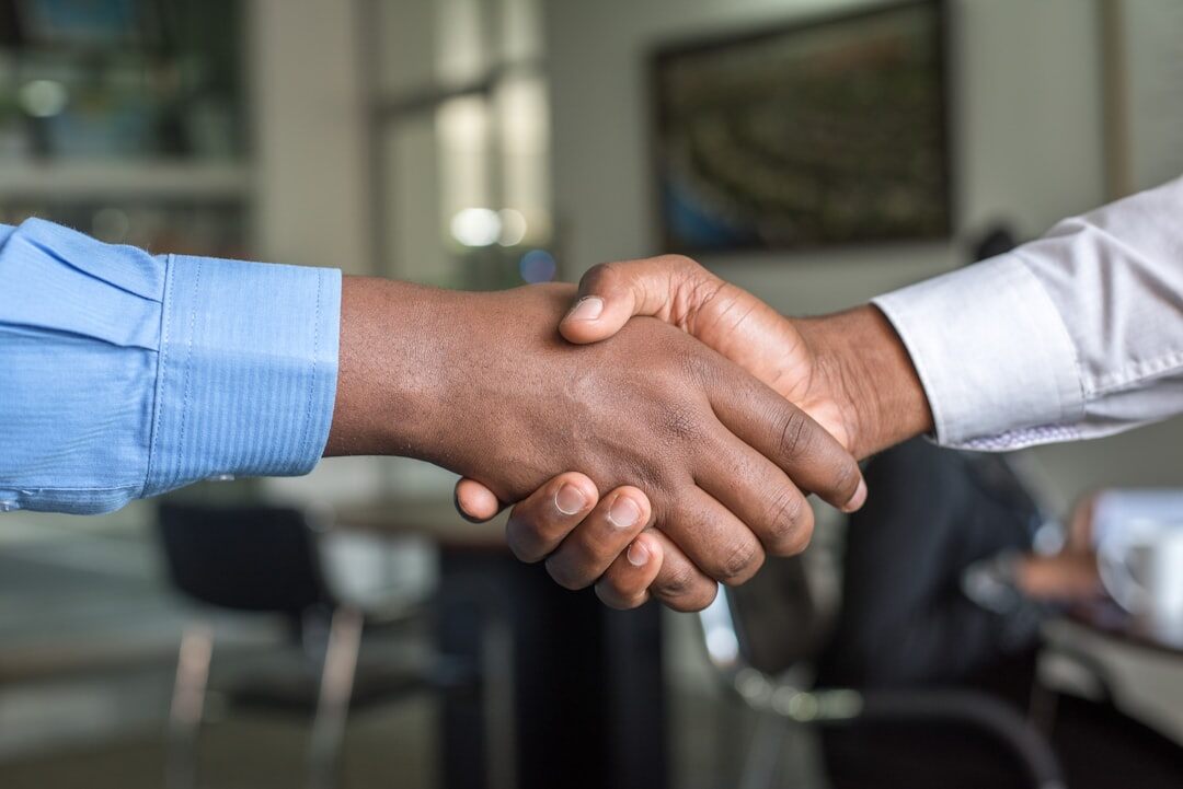 handshake closing deal at event