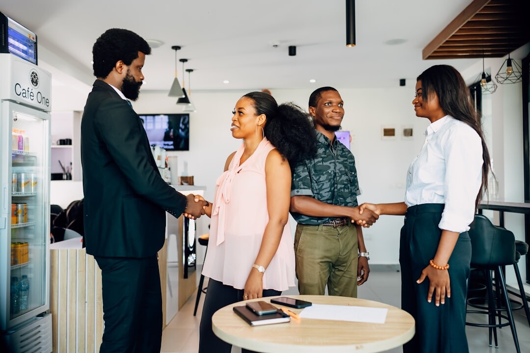 Business professionals networking and exchanging ideas during a summit break